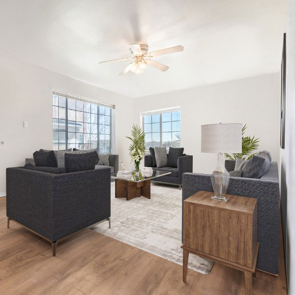 Decorated Living Space With Lounge Chairs And Large Windows
